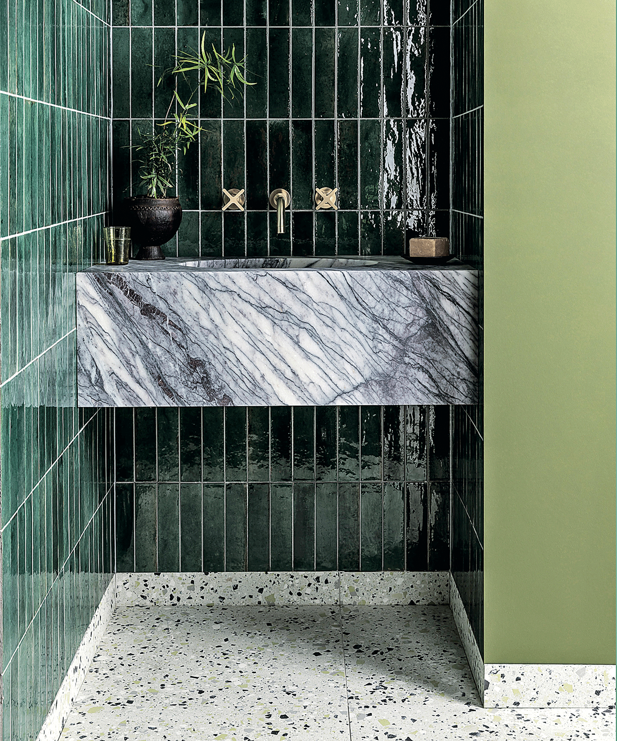 Glossy green tiles in bathroom