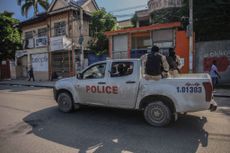 Police truck drives in Haiti