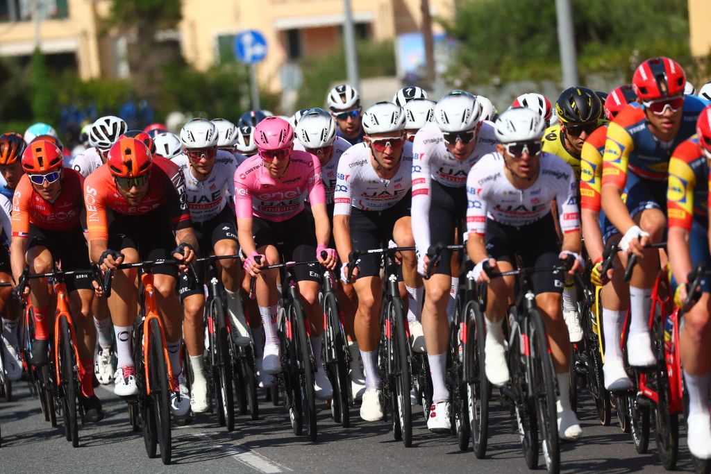Pink Jersey Team UAE's Slovenian rider Tadej Pogacar rides in the pack during the 4th stage of the 107th Giro d'Italia cycling race, 190 km between Acqui Terme and Andora, on May 7, 2024 in Andora. (Photo by Luca Bettini / AFP)