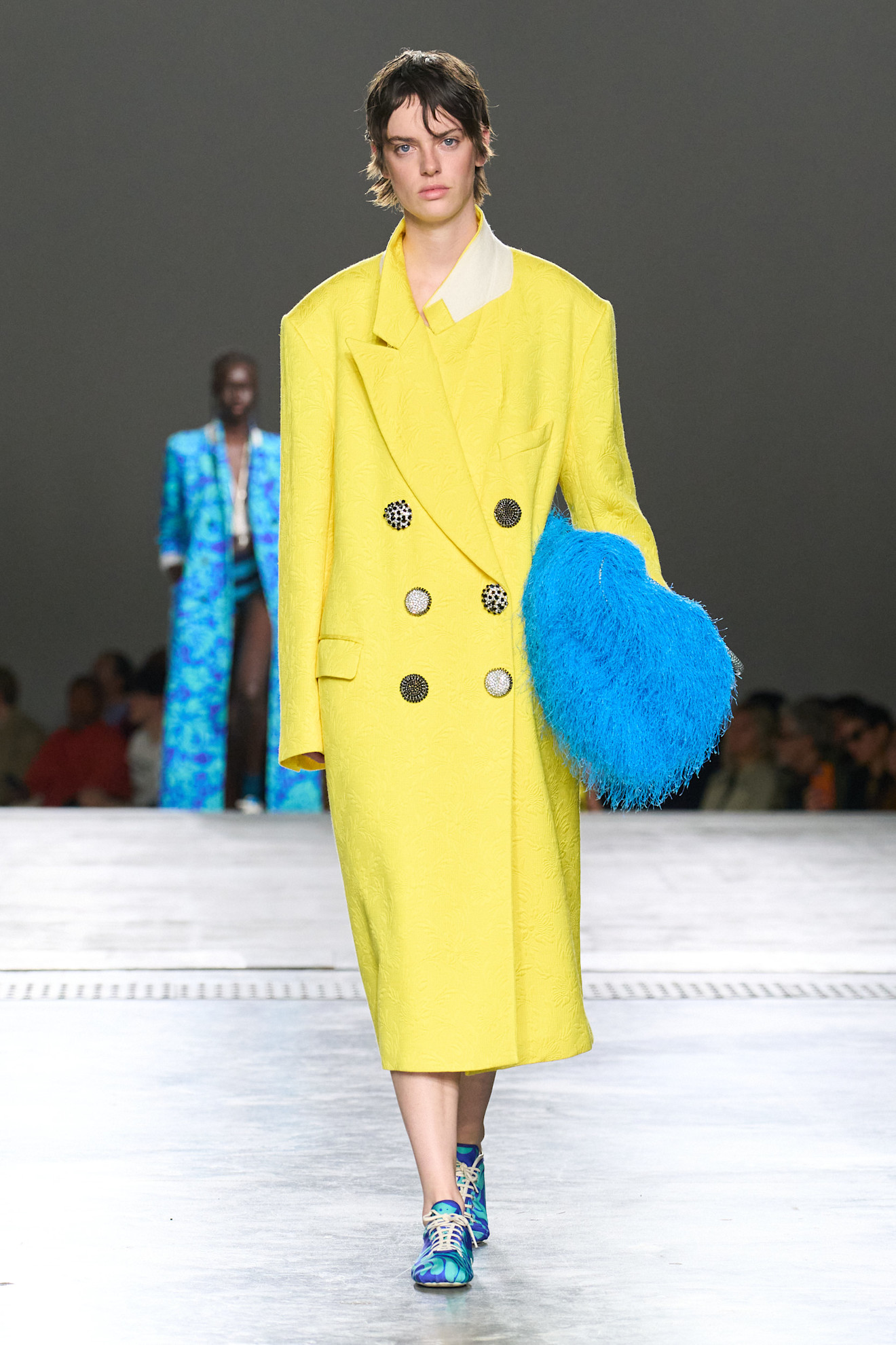 A model wore the blue and yellow color combination on the Dries Van Noten Spring 2026 runway