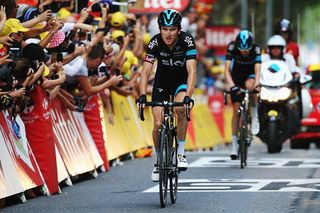 Geraint Thomas (Team Sky) crosses the line after crashing on the descent