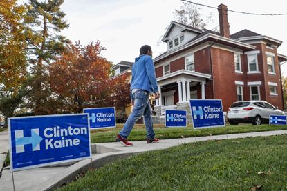 Clinton campaign signs litter the lawn of a home in Cincinnati.