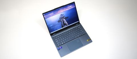 Acer Swift 14 AI (Intel) sitting on a white background with the display open showing the keyboard and touchpad