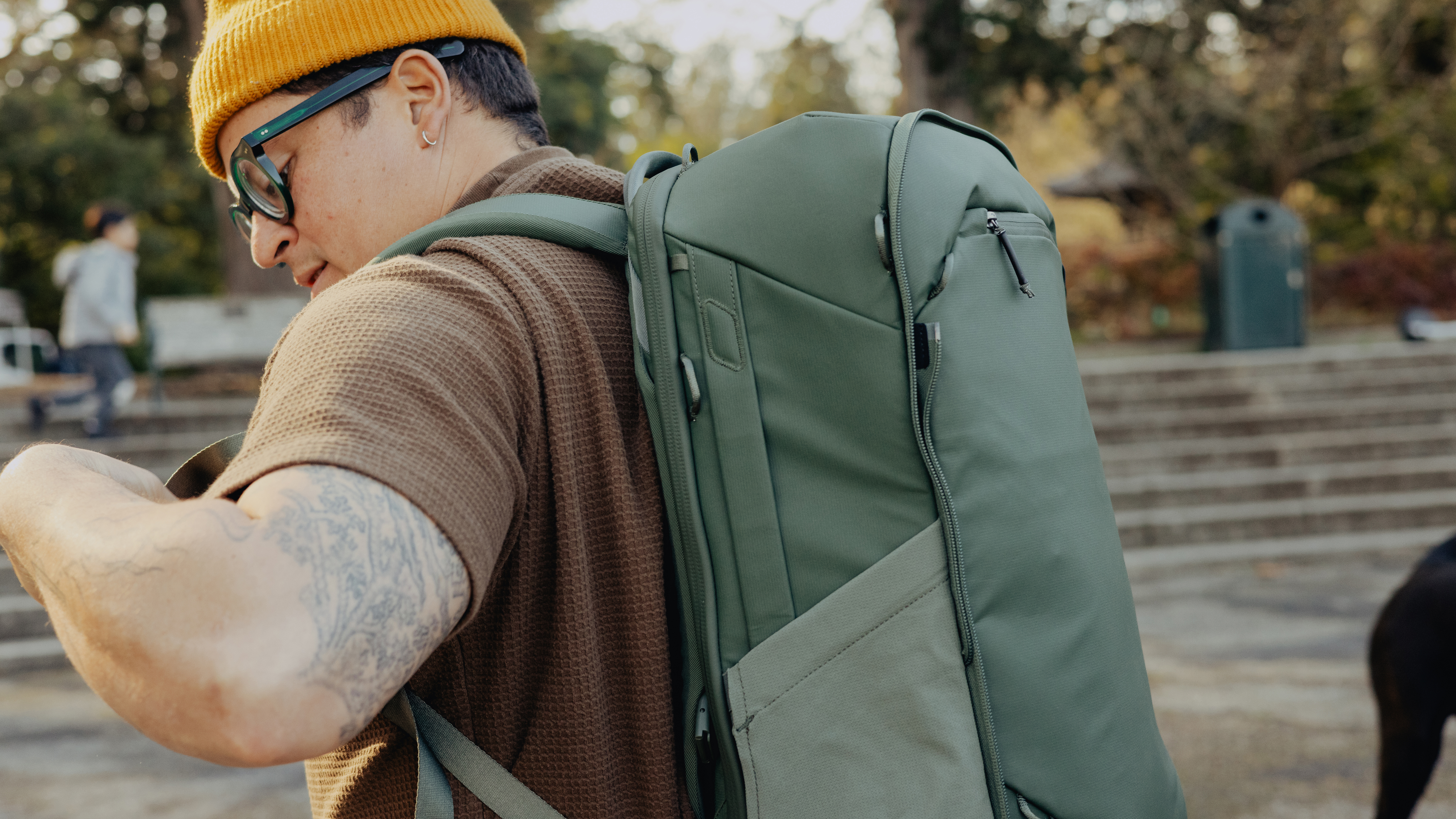 The Peak Design Travel 2-in-1 Backpack worn by a traveler, main pack only