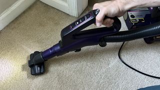 Shark POWERDETECT Upright Vacuum multipet tool in use on carpet