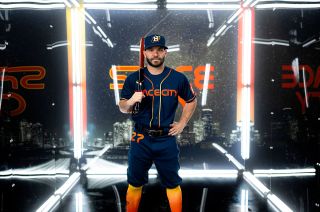 Houston Astros second baseman Jose Altuve models the baseball team's new Nike City Connect "Space City"-themed uniforms. The new uniforms celebrate Houston's connection to space exploration.
