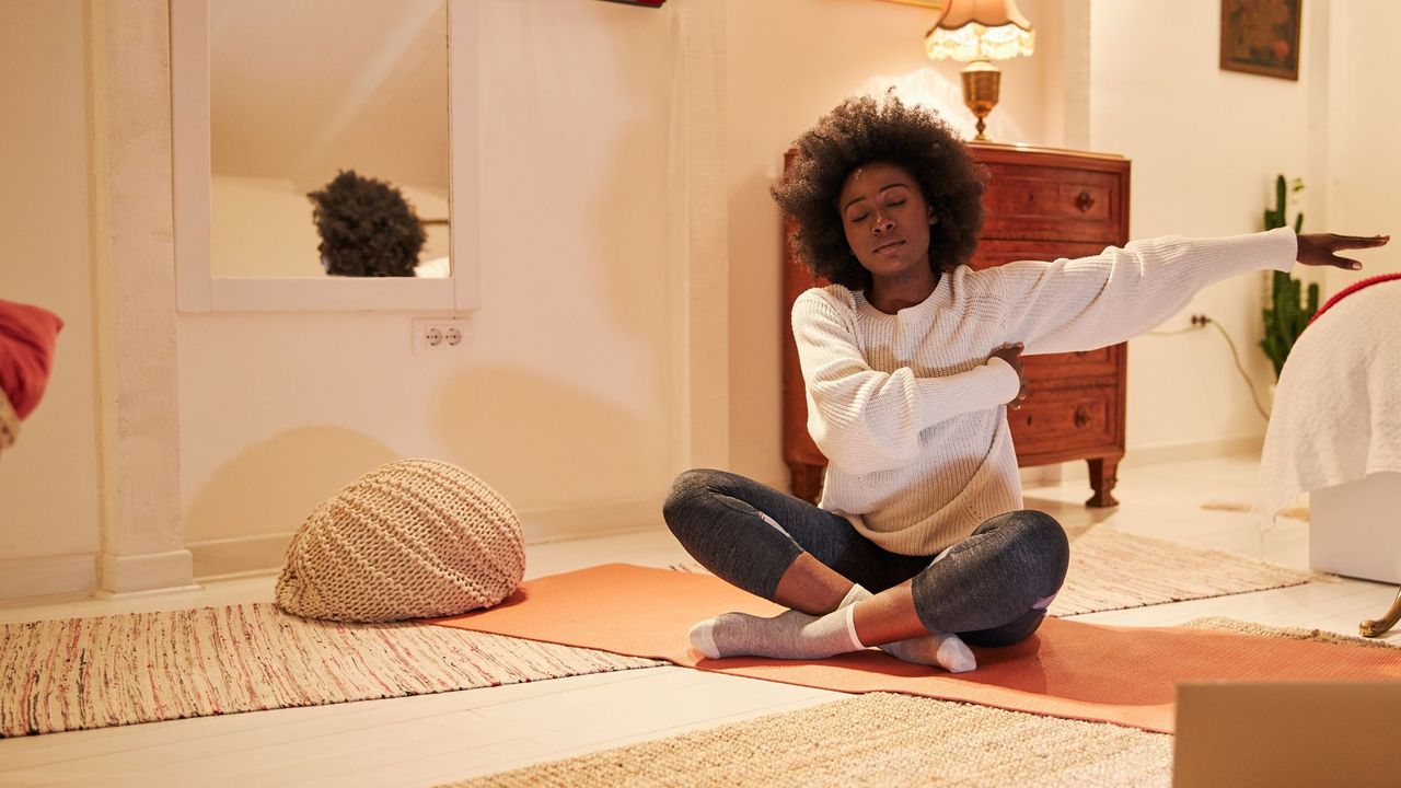 Cosy cardio: A woman stretching