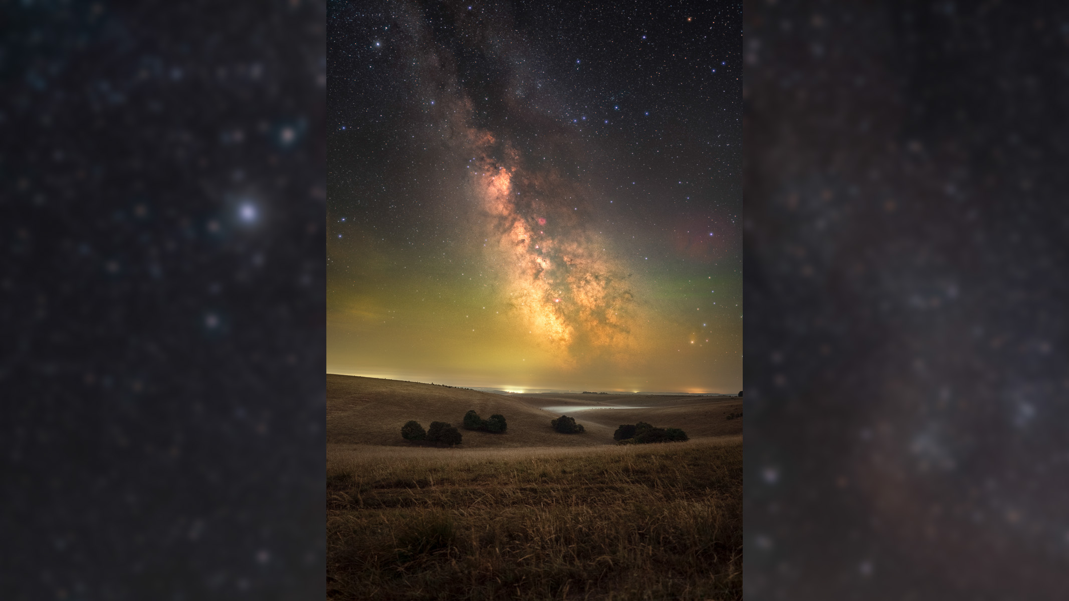 milky way above a landscape