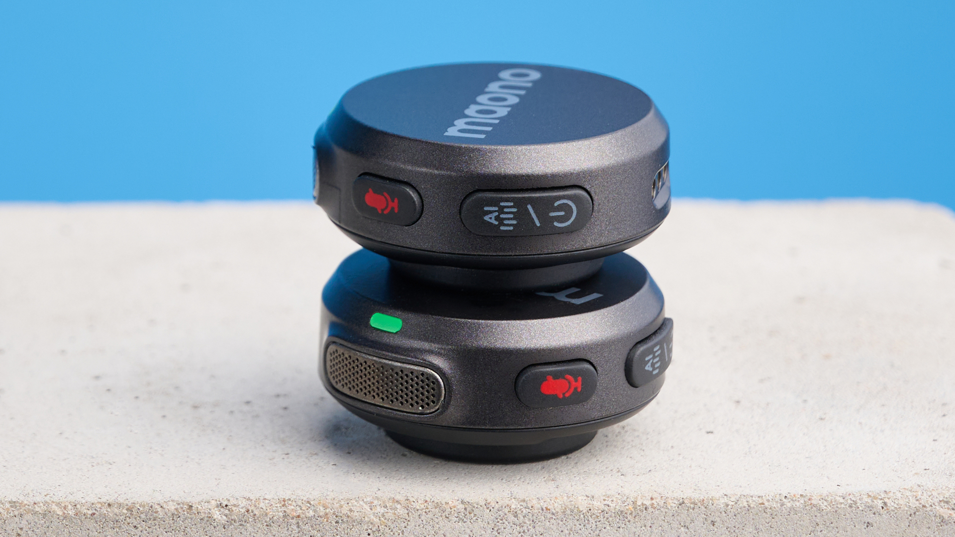 the maono wave t5 lavalier microphone shown against a blue background, showing the transmitters, receivers, and charging case