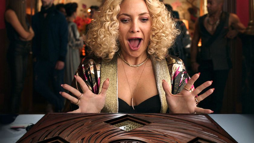 Best Netflix comedy movies: Kate Hudson as Birdie Jay looking shocked at a table during the Netflix movie, Glass Onion: A Knives Out Mystery.