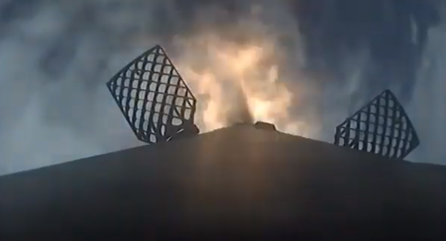 The Demo-2 SpaceX Falcon 9 rocket booster during its reentry burn after launch on May 30, 2020.