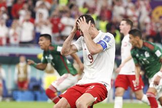 Poland striker Robert Lewandowski reacts after missing a penalty against Mexico at the 2022 World Cup.