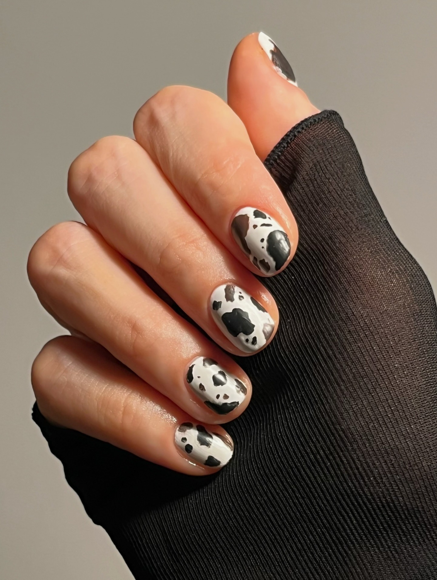 A cow print manicure