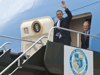 President Barack Obama waves as he exits Air Force One along with Senator Bill Nelson after landing at the NASA Kennedy Space Center in Cape Canaveral, Fla. on Thursday, April 15, 2010.