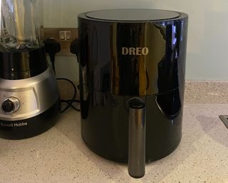 Dreo air fryer review in process sat on the side