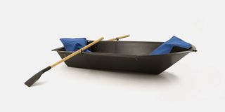 Black folding boat with oars