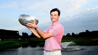 Rasmus Hojgaard poses for a photo with the Made In Himmerland trophy