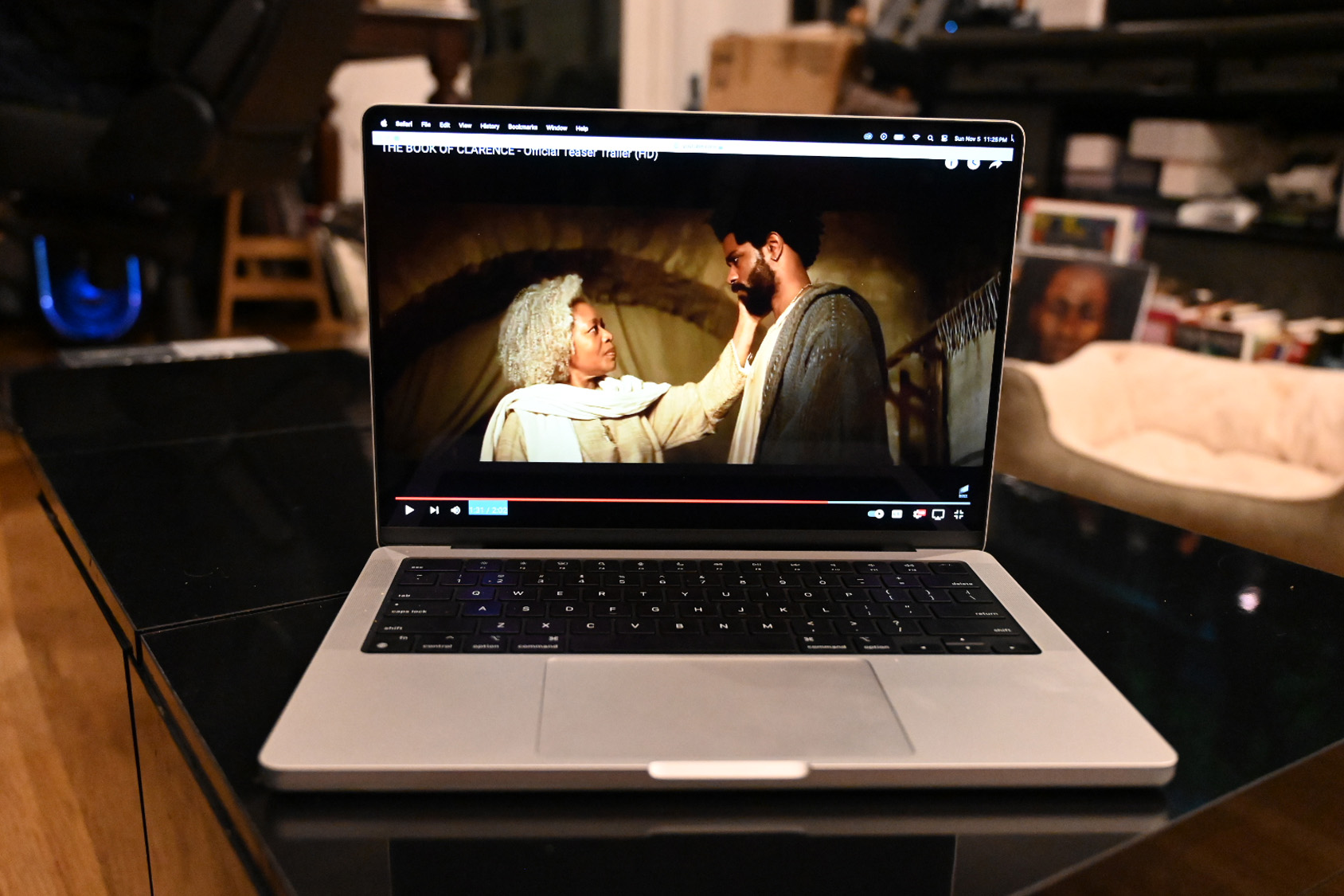 MacBook Pro 14-inch (M3, 2023) open showing a movie trailer to demonstrate brightness and vibrancy