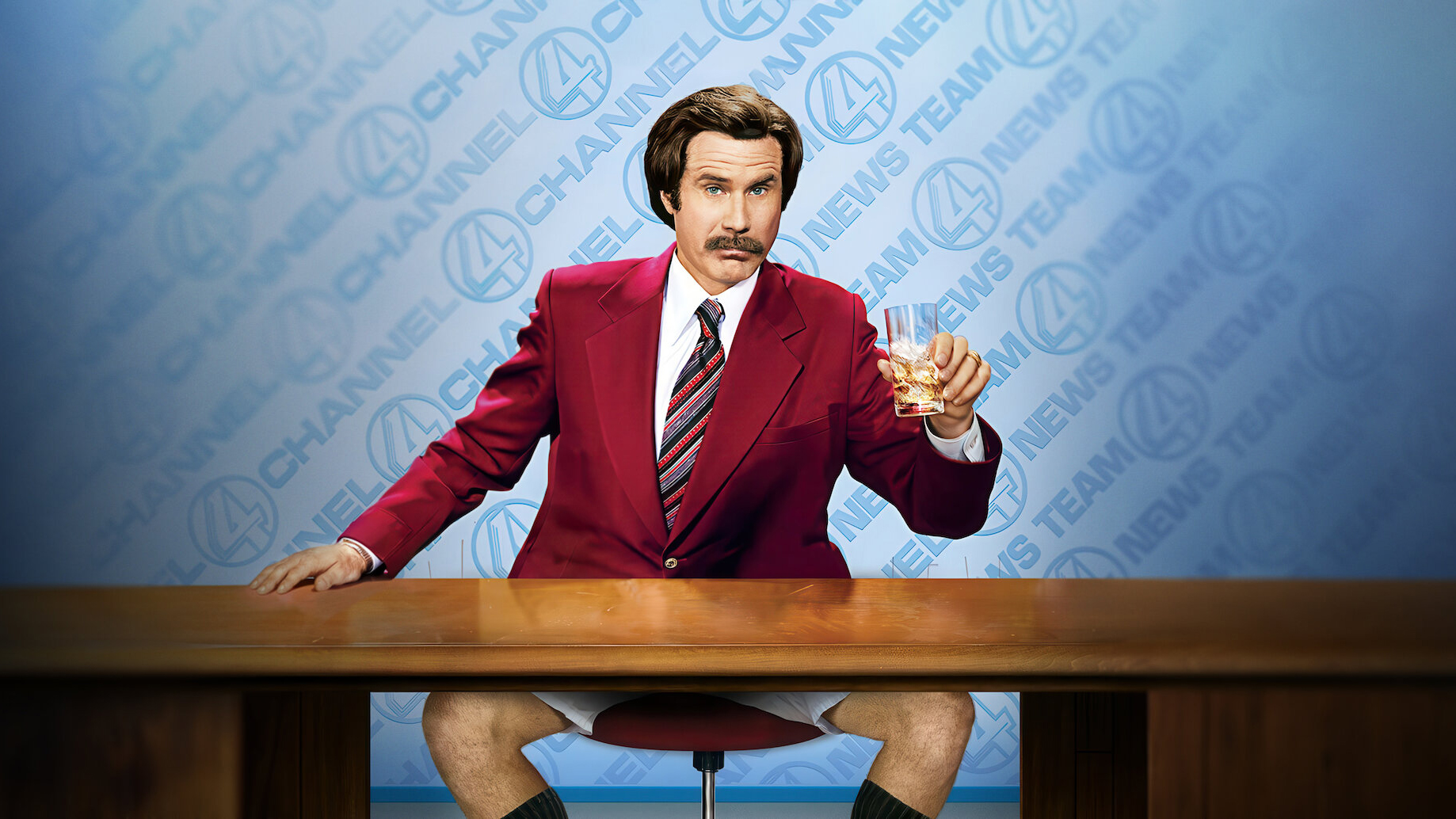 Ron Burgandy at his desk, without trousers on.