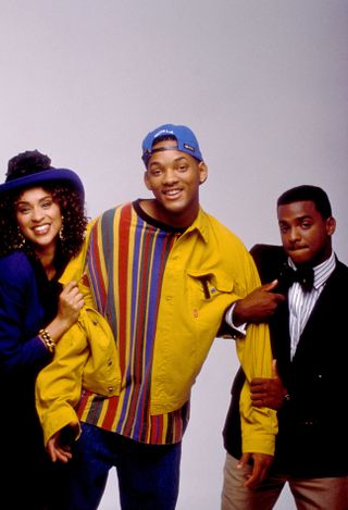 a promo shot of the fresh prince of bel air with will smith in the center and his cousins on his arms