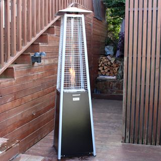 The Outsunny 11.2kw Pyramid Gas Patio Heater being unboxed and tested on a wooden deck
