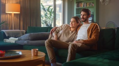 Couple watching a streaming service from the couch