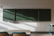 Empty classroom with an empty blackboard.