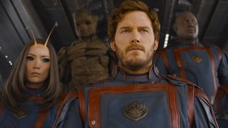 Mantis, Groot, Star-Lord, and Drax walk down a starship ramp in Guardians of the Galaxy 3