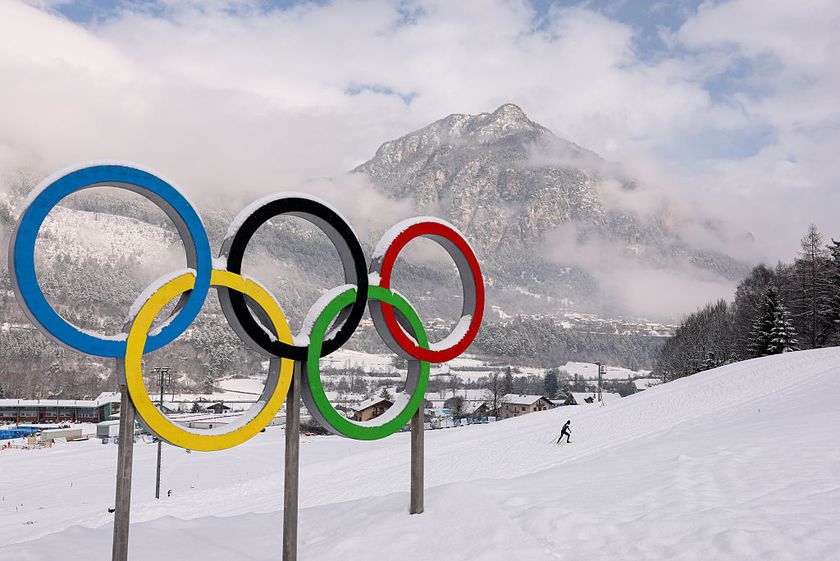Milano Cortina Olympics - rings in front of a mountain