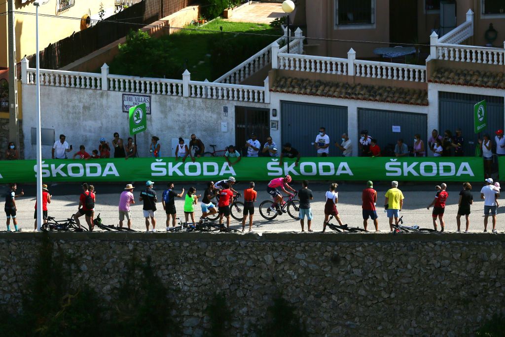 ALTO DE LA MONTAA DE CULLERA SPAIN AUGUST 19 LR Bertjan Lindeman of Netherlands and Team Qhubeka Nexthash Magnus Cort Nielsen of Denmark and Team EF Education Nippo climb the Alto de la Montaa de Cullera 184m while fans cheer during the 76th Tour of Spain 2021 Stage 6 a 1583km stage from Requena to Alto de la Montaa de Cullera 184m lavuelta LaVuelta21 on August 19 2021 in Alto de la Montaa de Cullera Spain Photo by Gonzalo Arroyo MorenoGetty Images