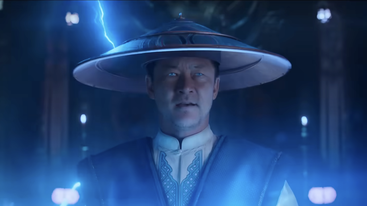 Raiden bathed in blue light with lightning bolt behind his hat in Mortal Kombat II