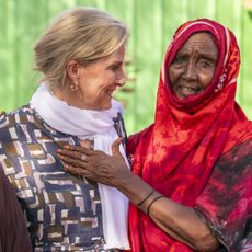 Duchess Sophie with her arms around Somalian women