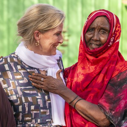 Duchess Sophie with her arms around Somalian women