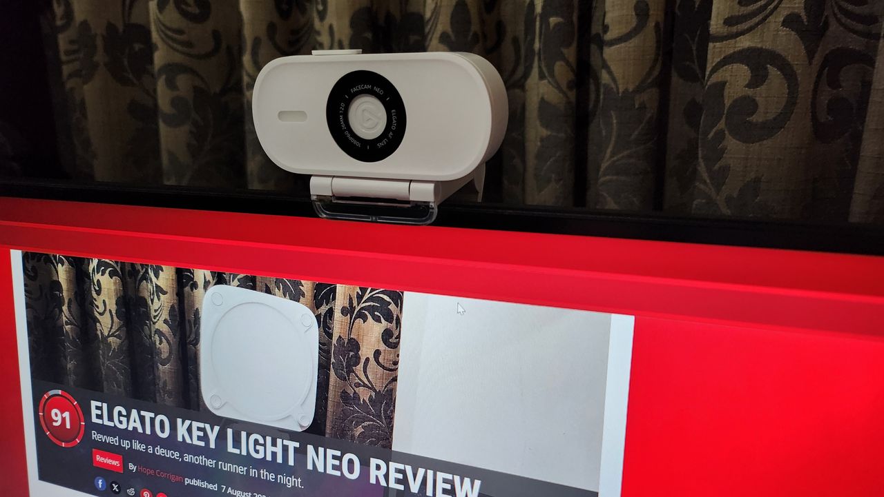 Elgato Facecam Neo set up on a desk.