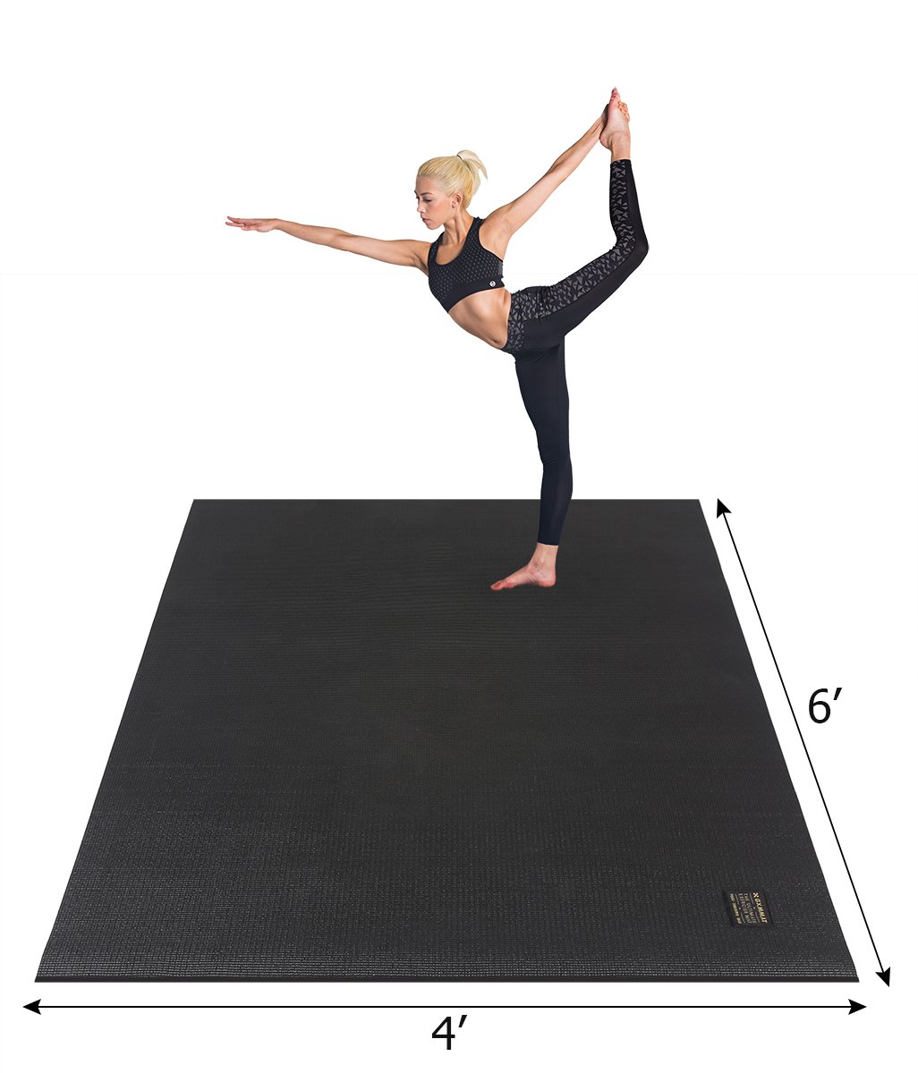 woman doing yoga on large mat