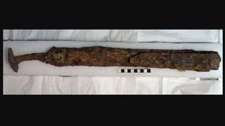 This iron sword was folded in a ritual "killing" before it was buried with a soldier about 1,600 years ago.