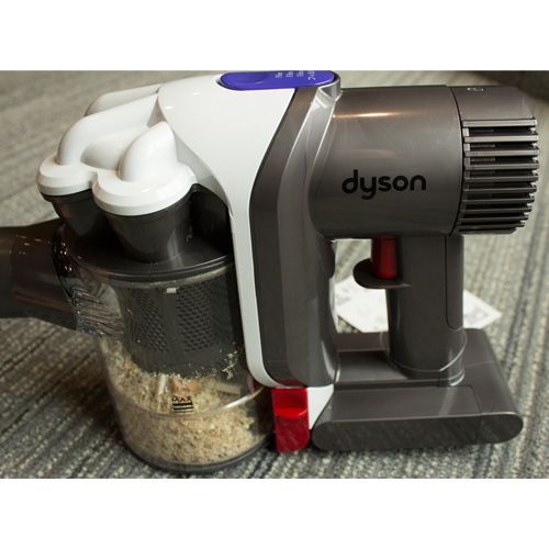 The Dyson V6 dust bin holds 0.5 liters and can be clicked on and off the vacuum for easy emptying.
