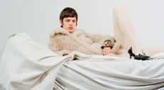 Pre-Fall 2024 Best Looks Fashion Shoot featuring woman in shearling jacket on draped fabric