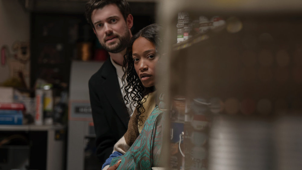L-R: Rob (Jack Whitehall) and Samira (Keke Palmer) look around a corner in a scene from Peacock's &amp;quot;The Burbs&amp;quot;