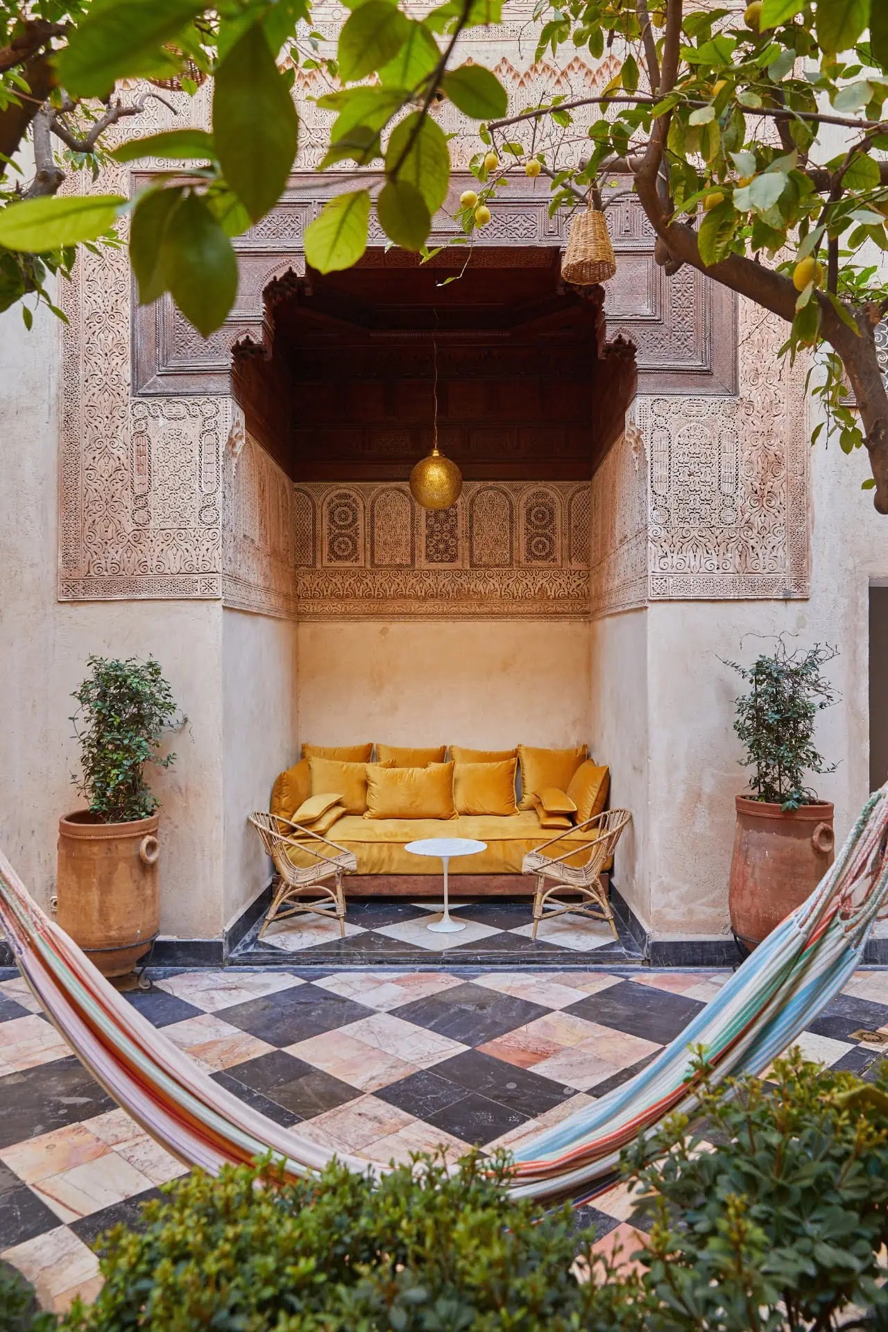 A colorful Moroccan riad has been transformed into a kaleidoscope of patterned textiles, striking artwork, and eye-catching tiles.