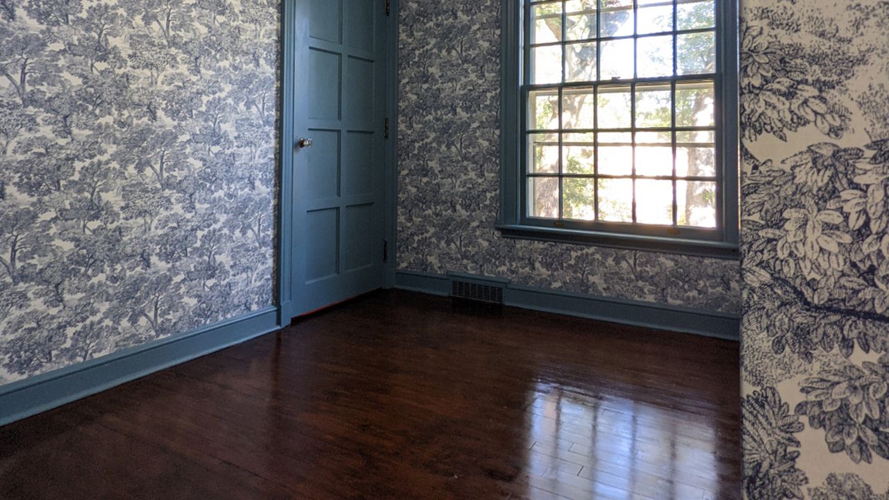 newly stained wood floor in a bedroom