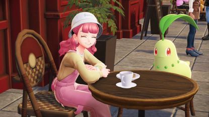 A pink-haired trainer and a Chikorita sit outside a cafe in Pokemon Legends: Z-A.
