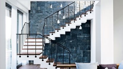 Modern staircase with white pendant lighting