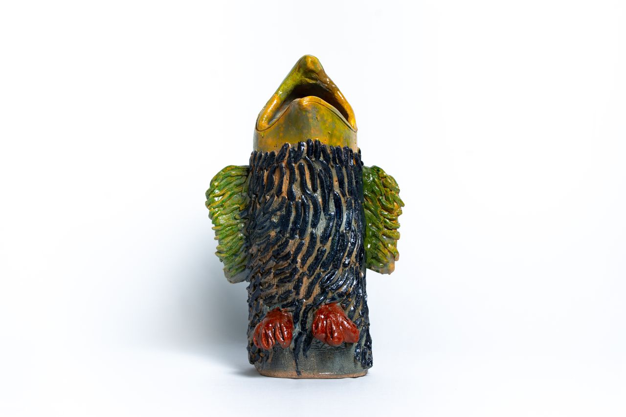 Colourful animal head ceramic vessels