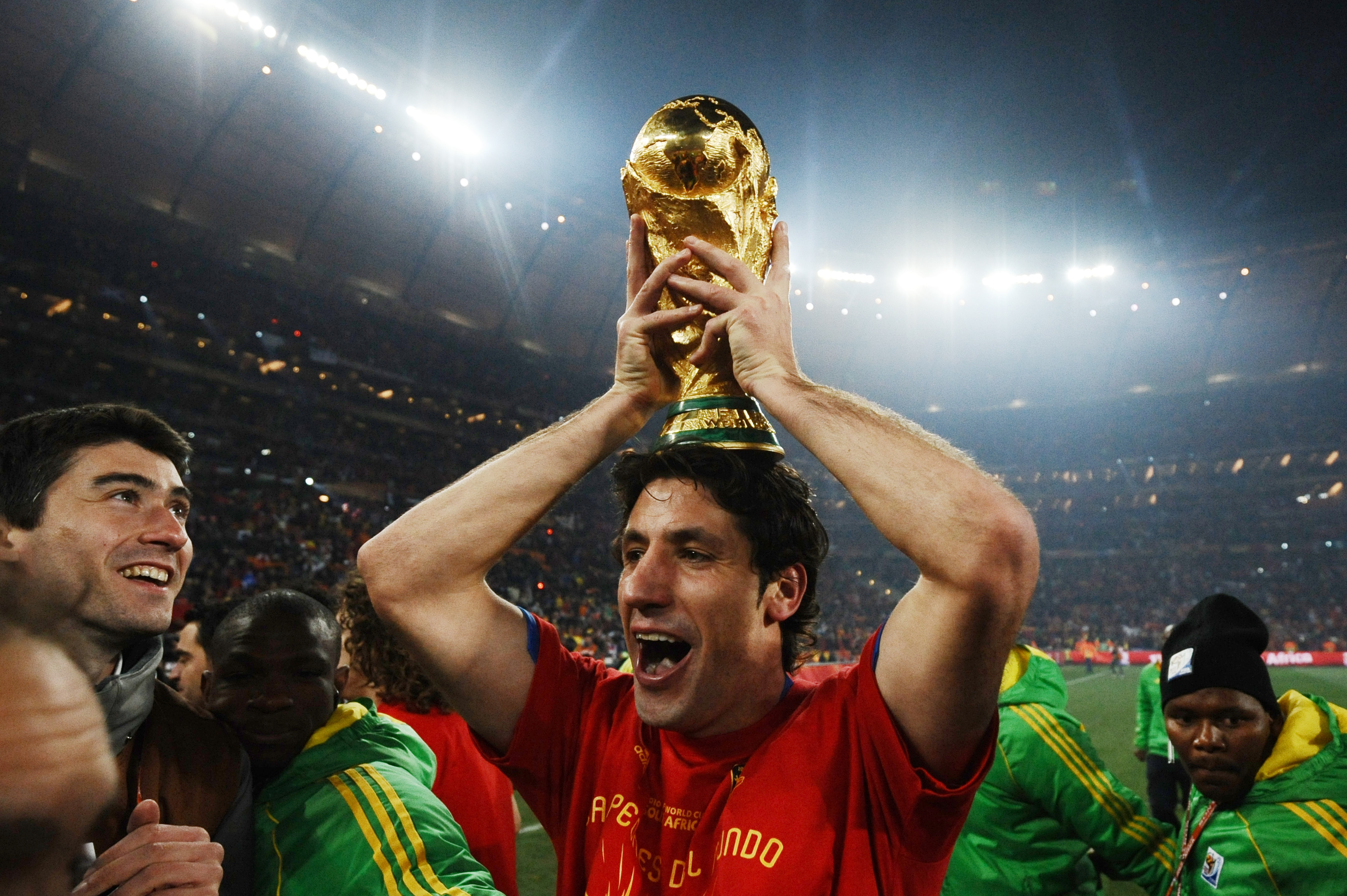 Spain defender Joan Capdevila celebrates with the World Cup trophy after victory over the Netherlands in the 2010 World Cup final in South Africa.