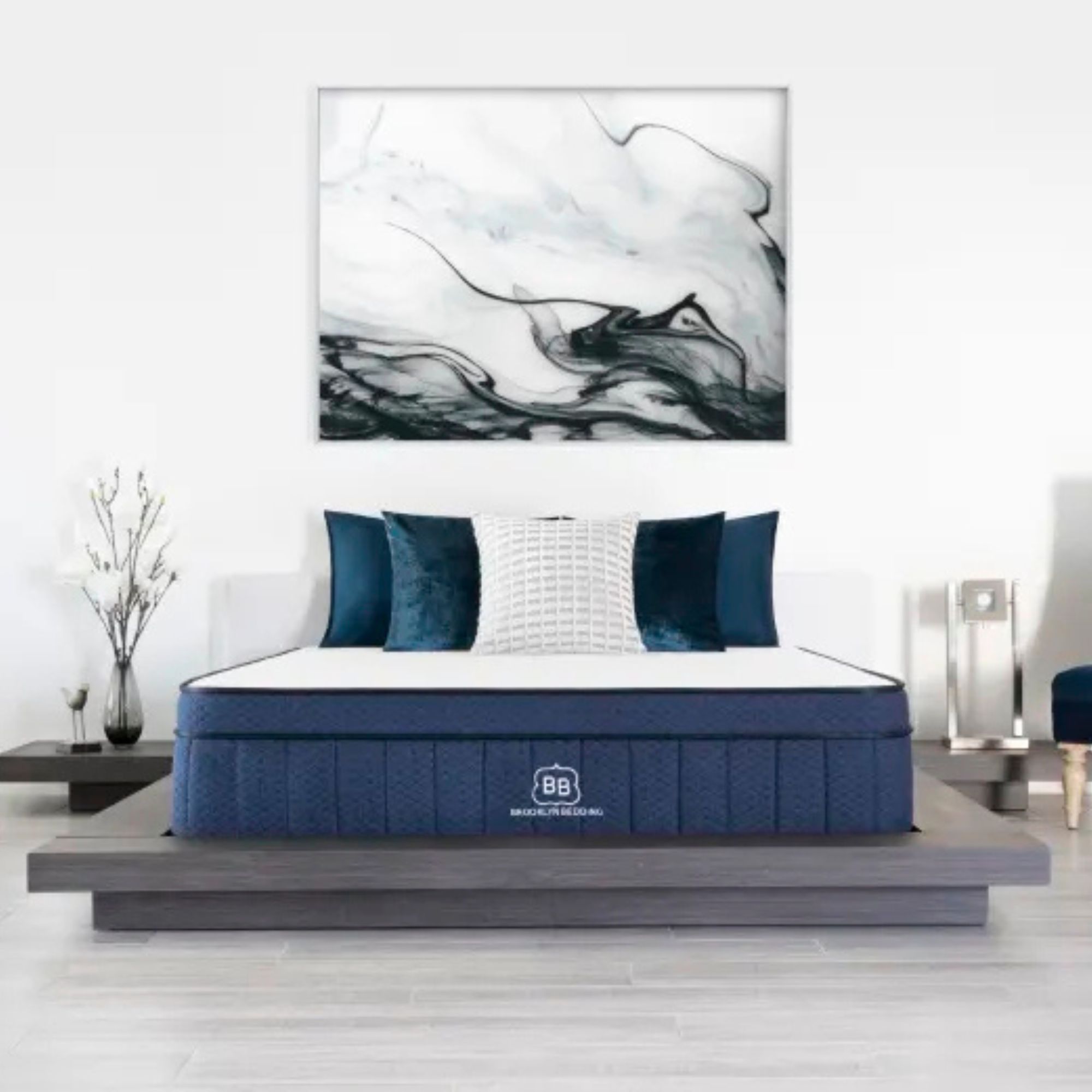 Brooklyn Bedding Aurora Luxe Cooling Mattress on a bed against a white wall. 