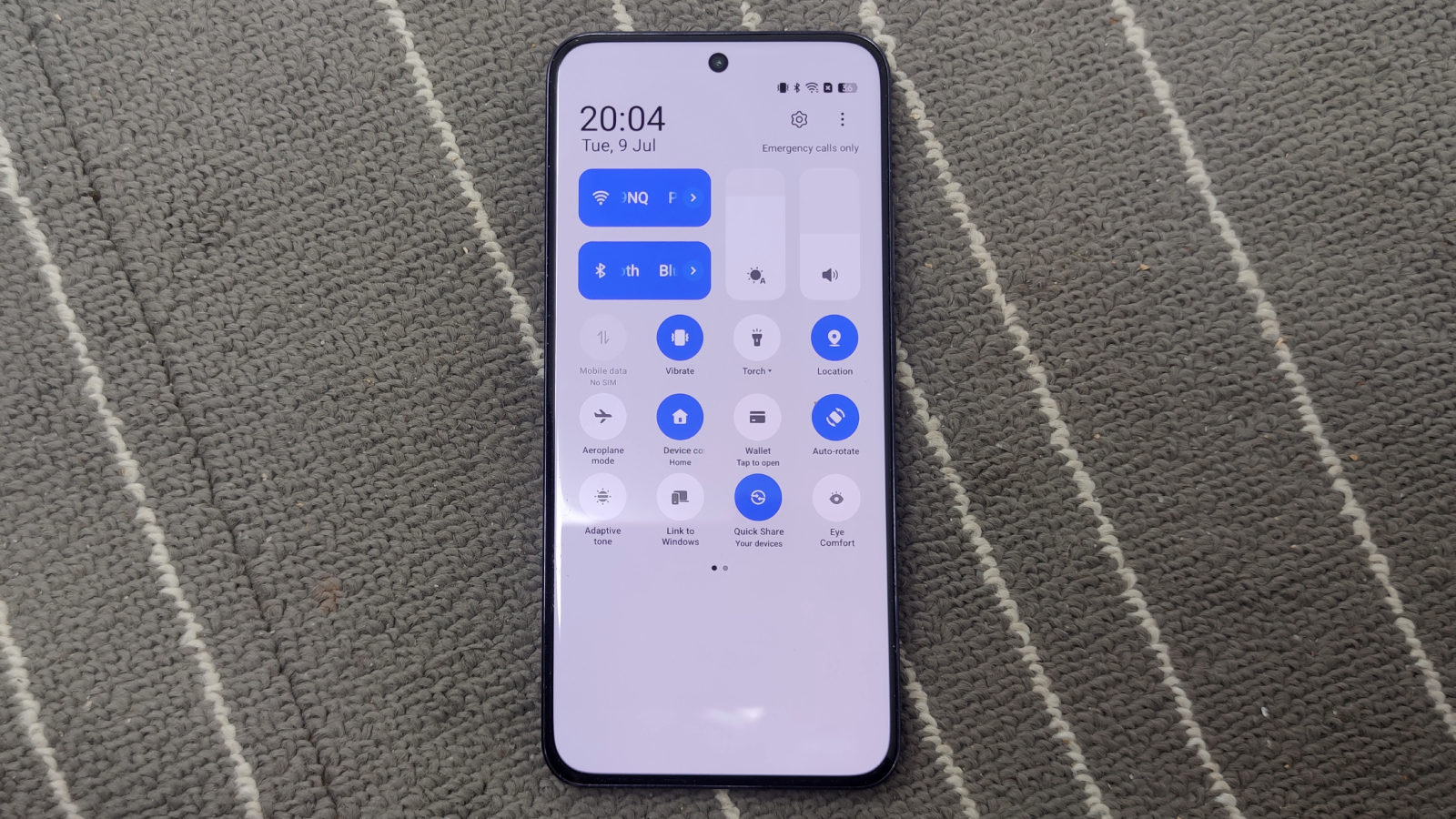 The Oppo Reno 12 Pro on a gray and white background.