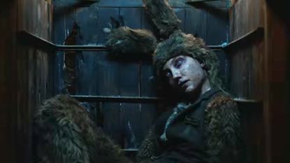 An apparently dead person wearing a matted fur bunny suit