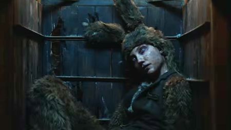 An apparently dead person wearing a matted fur bunny suit