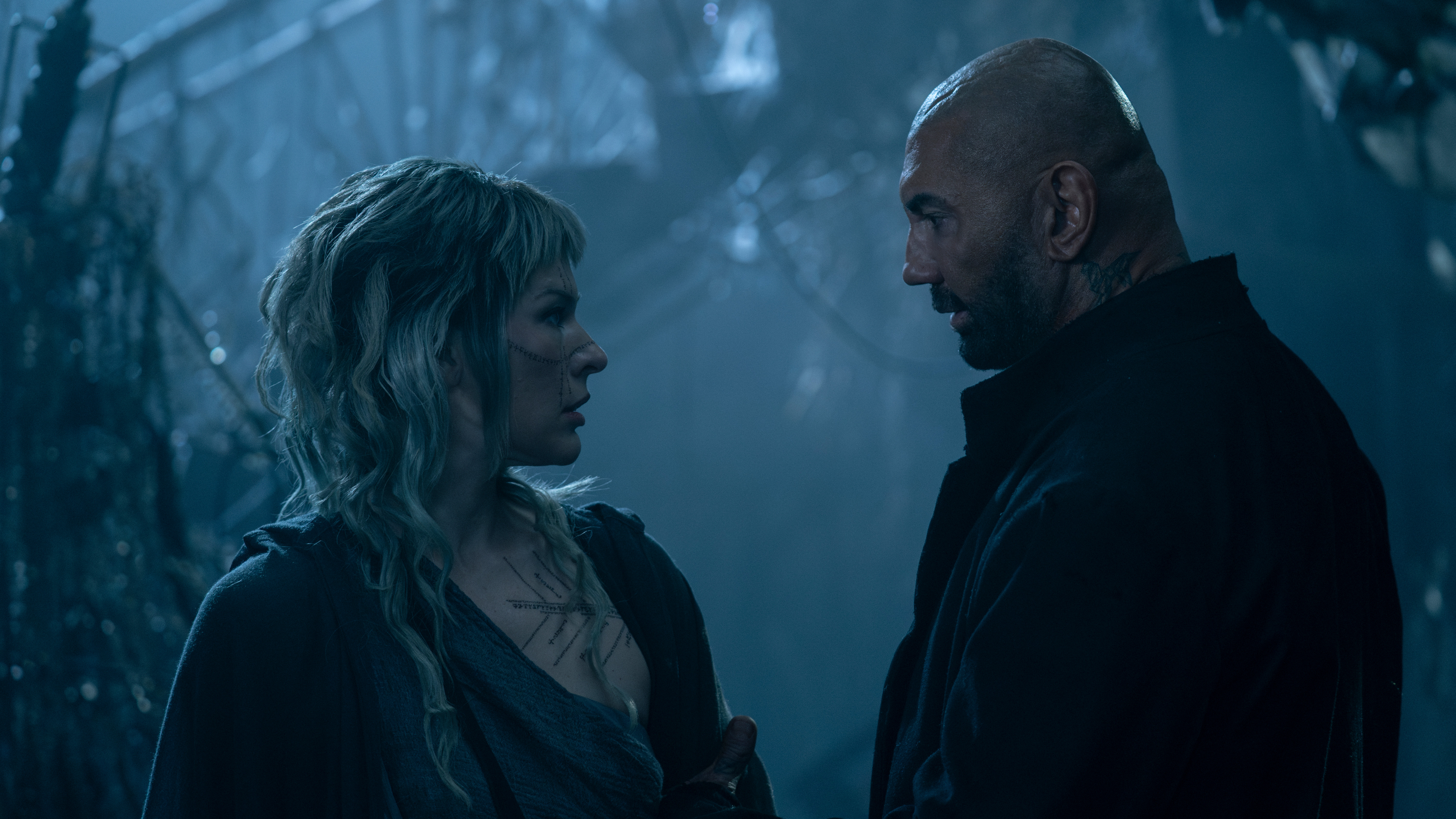 Milla Jovovich and Dave Bautista in In the Lost Lands.